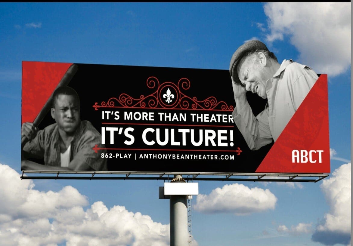 A billboard with two men on it and the words 