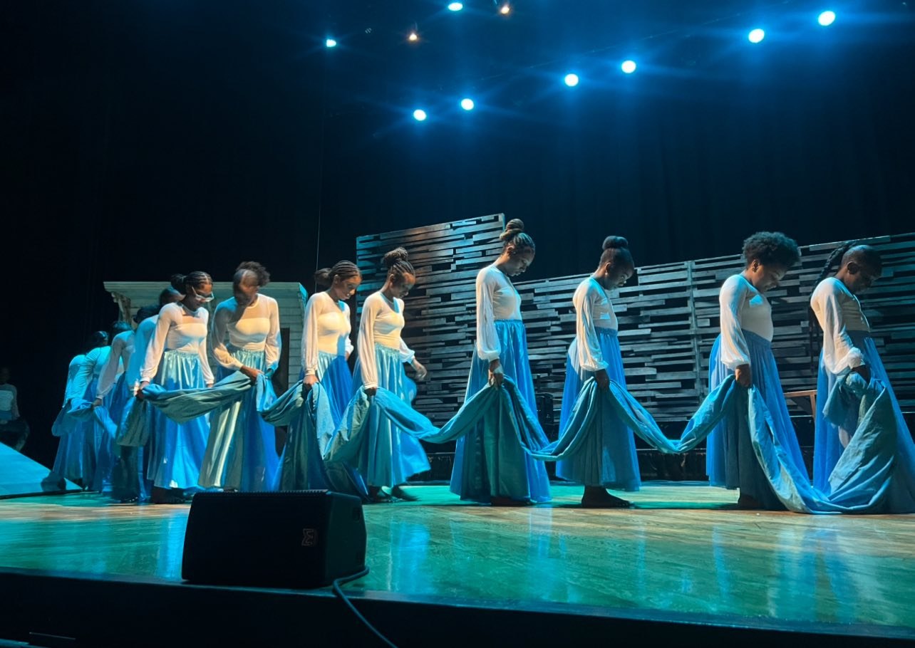 Young dancers in white and blue with flowing fabric